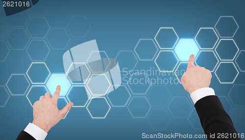 Image of close up of businessman pointing to something