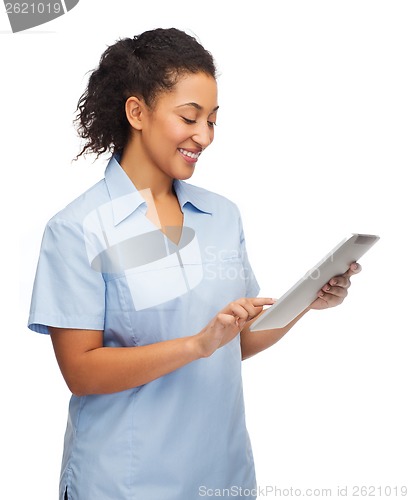 Image of smiling black doctor or nurse with tablet pc