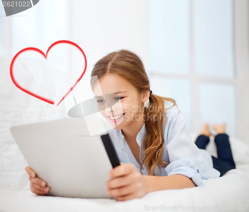 Image of girl with tablet pc at home