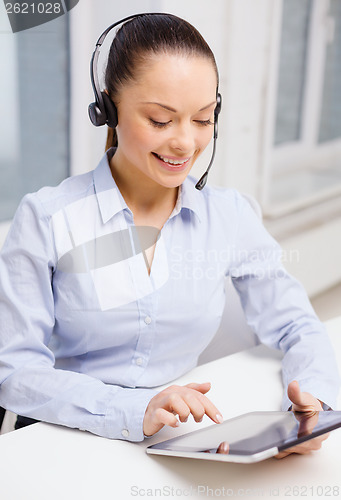 Image of friendly female helpline operator with tablet pc