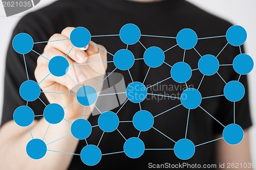 Image of man writing drawing social or business network