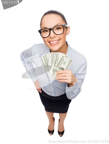 Image of smiling businesswoman with dollar cash money