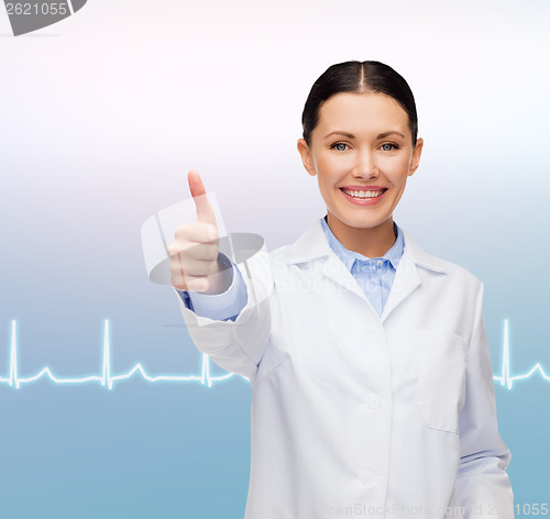 Image of smiling female doctor showing thumbs up