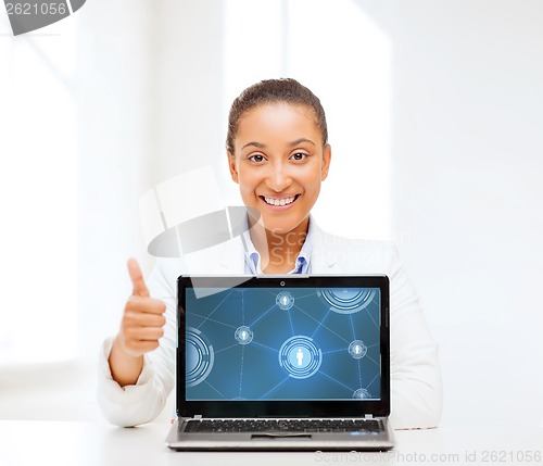 Image of smiling woman with laptop computer