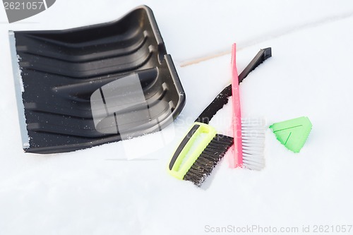 Image of variety of snow cleaning equipment on snow