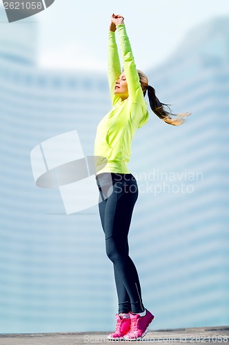 Image of woman doing yoga outdoors