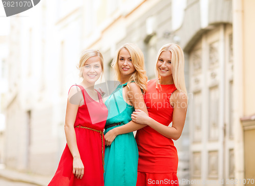 Image of three beautiful women in the city