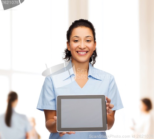 Image of smiling female doctor or nurse with tablet pc