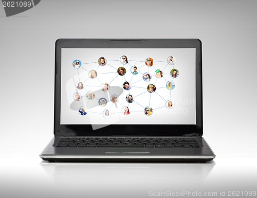 Image of laptop computer with social network on screen