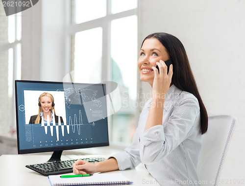 Image of smiling businesswoman or student with smartphone