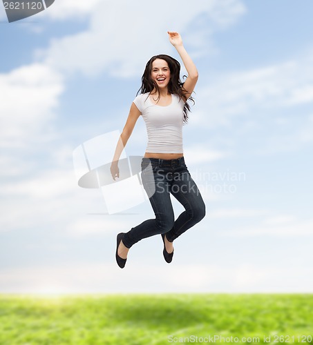 Image of teenage girl in white blank t-shirt jumping