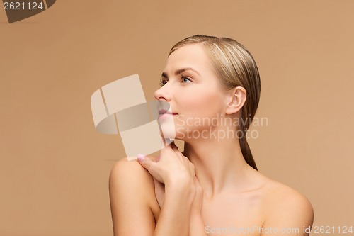 Image of face and hands of beautiful woman