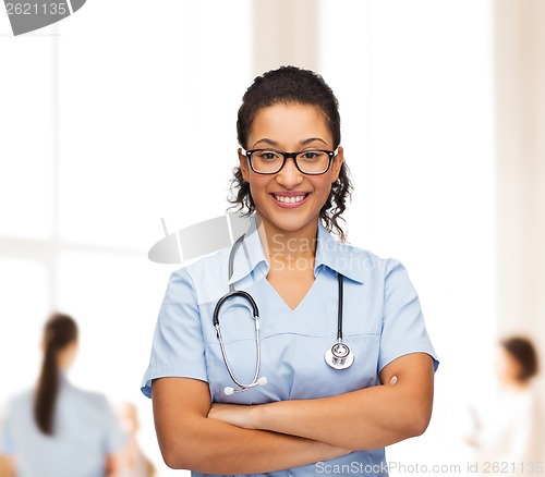 Image of smiling female african american doctor or nurse