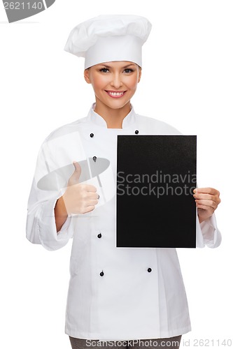 Image of smiling female chef with black blank paper