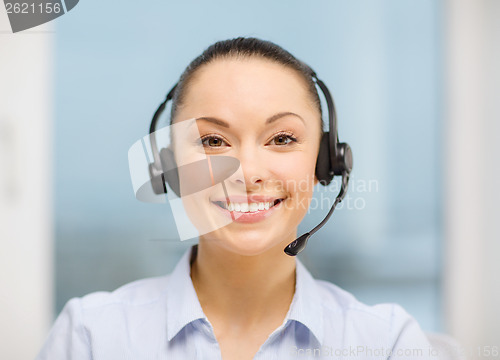 Image of female helpline operator with headphones