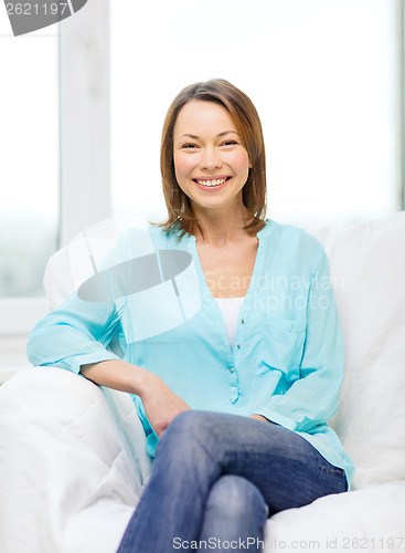 Image of smiling woman at home