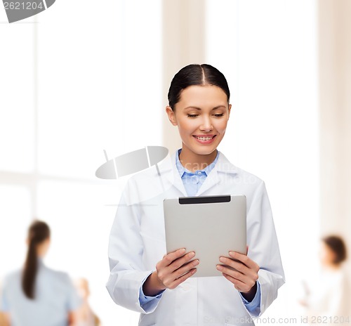 Image of female doctor without stethoscope and tablet pc