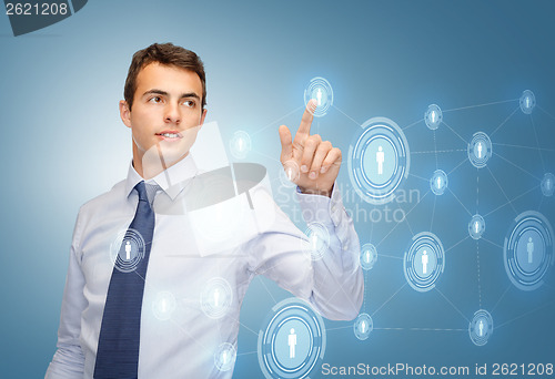 Image of businessman working with imaginary virtual screen