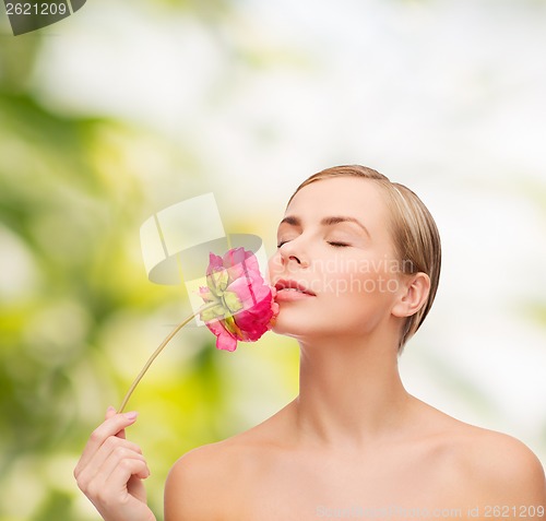 Image of lovely woman with peonie flower