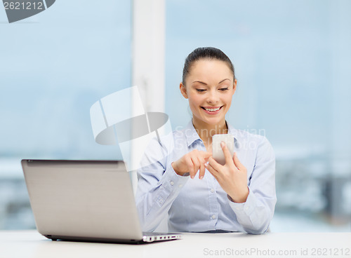 Image of smiling businesswoman with laptop