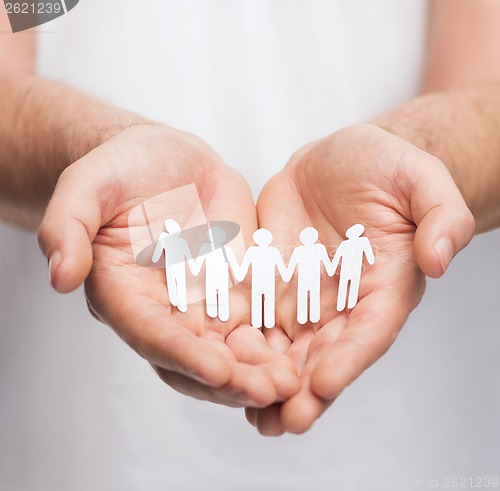 Image of man hands with paper team