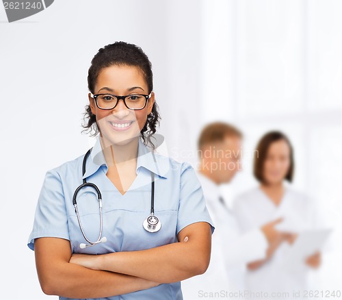 Image of smiling female african american doctor or nurse