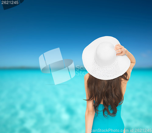 Image of model in swimsuit with hat