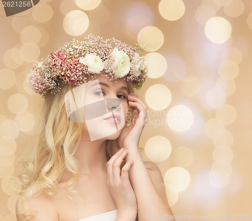 Image of woman wearing wreath of flowers