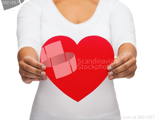 Image of closeup of woman hands with heart
