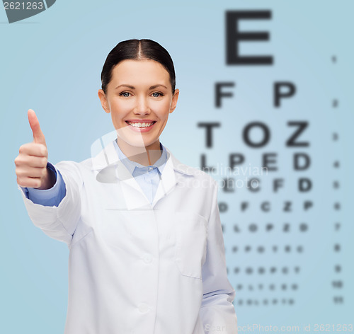 Image of smiling female doctor showing thumbs up