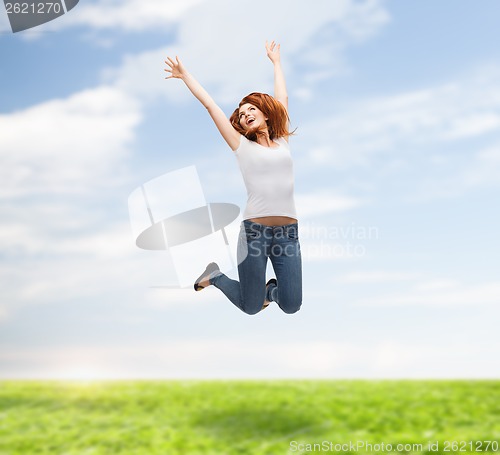 Image of teenage girl in white blank t-shirt jumping