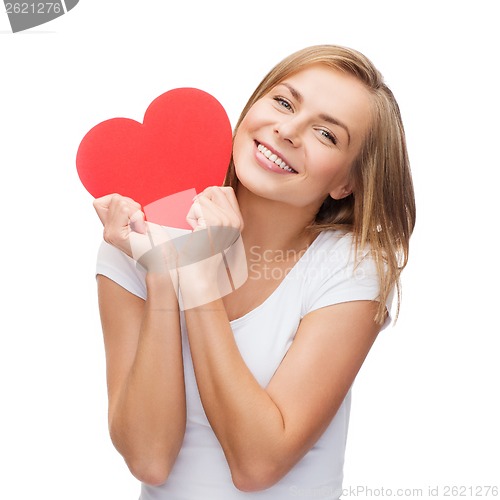 Image of smiling woman in white t-shirt with heart