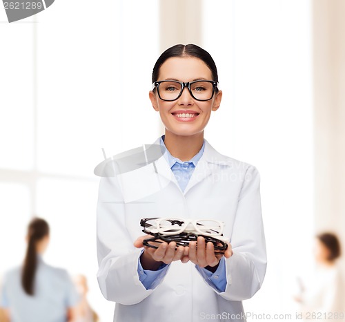 Image of smiling female doctor with eyeglasses