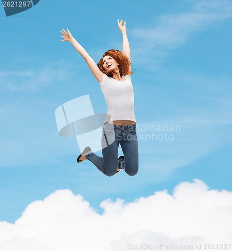 Image of teenage girl in white blank t-shirt jumping