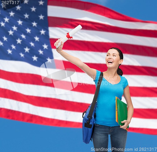 Image of smiling student with bag and folders