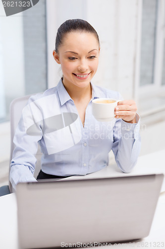Image of smiling businesswoman or student with laptop