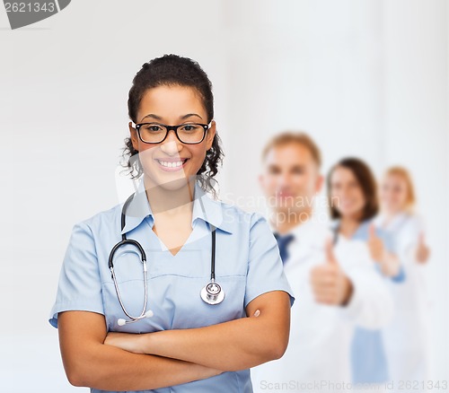 Image of smiling female african american doctor or nurse