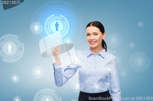 Image of smiling businesswoman pointing finger at you