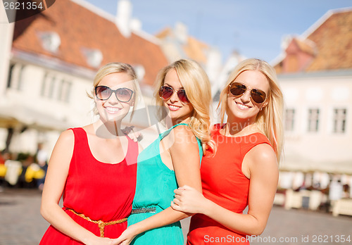 Image of three beautiful women in the city