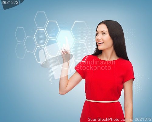 Image of woman in red dress and virtual screen