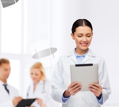 Image of female doctor without stethoscope and tablet pc