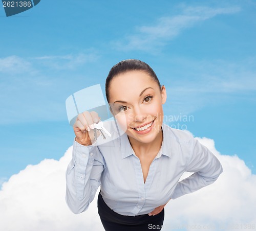 Image of smiling businesswoman with house keys