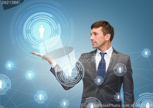 Image of buisnessman or teacher showing contact icon