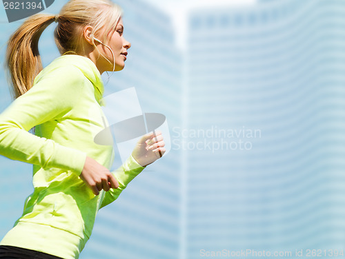 Image of woman doing running outdoors