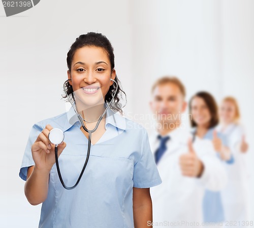 Image of smiling female african american doctor or nurse