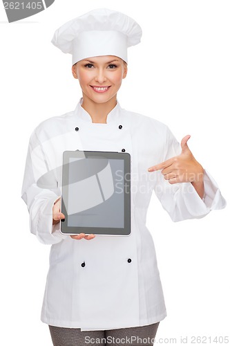 Image of smiling female chef with tablet pc blank screen