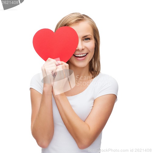 Image of smiling woman in white t-shirt with heart
