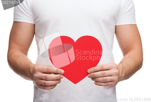 Image of closeup of man hands with heart