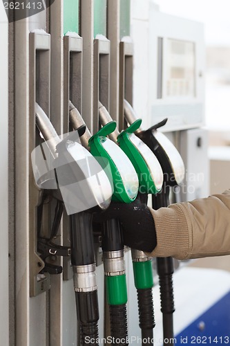 Image of close up of male hand holding fuel pump