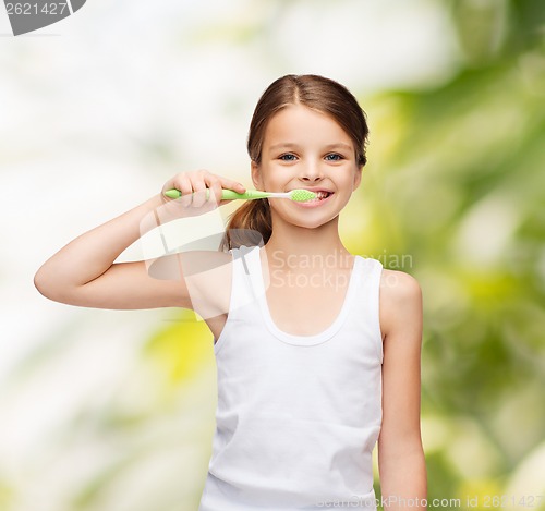 Image of girl in blank white shirt brushing her teeth